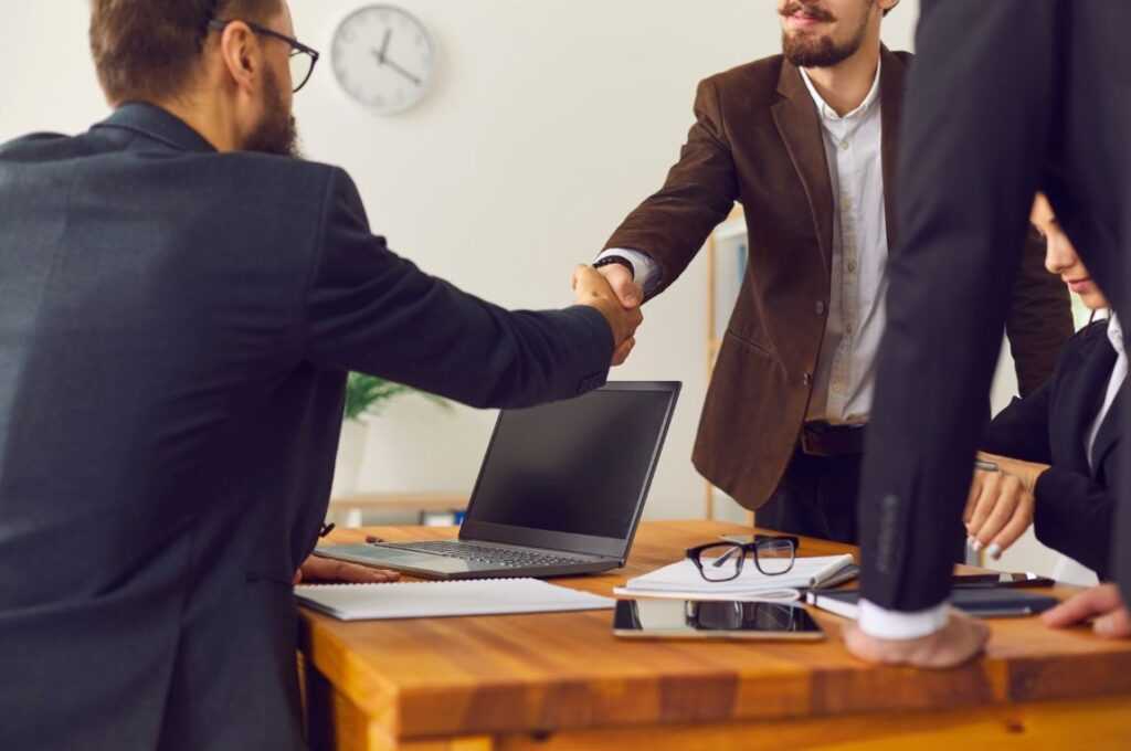 Man thanking each other because a new start-up deal is completed|